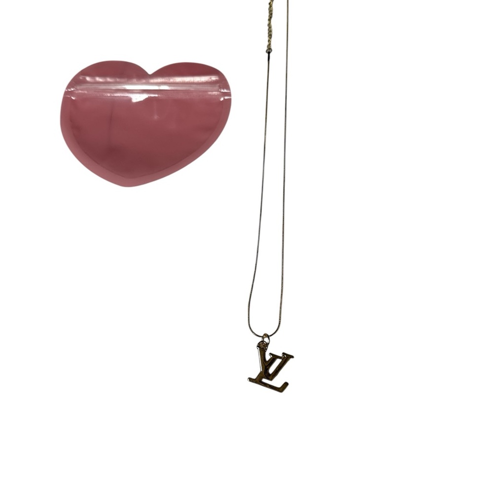 Gold Necklace with Interlocking Pendant
It is a great Valentines gift - Picture 1 of 3